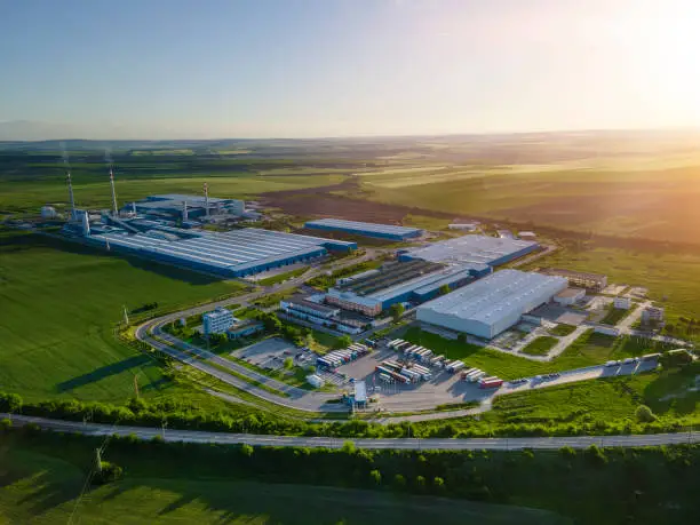 Sustainability Milestone In Industrial Development Building in farmland